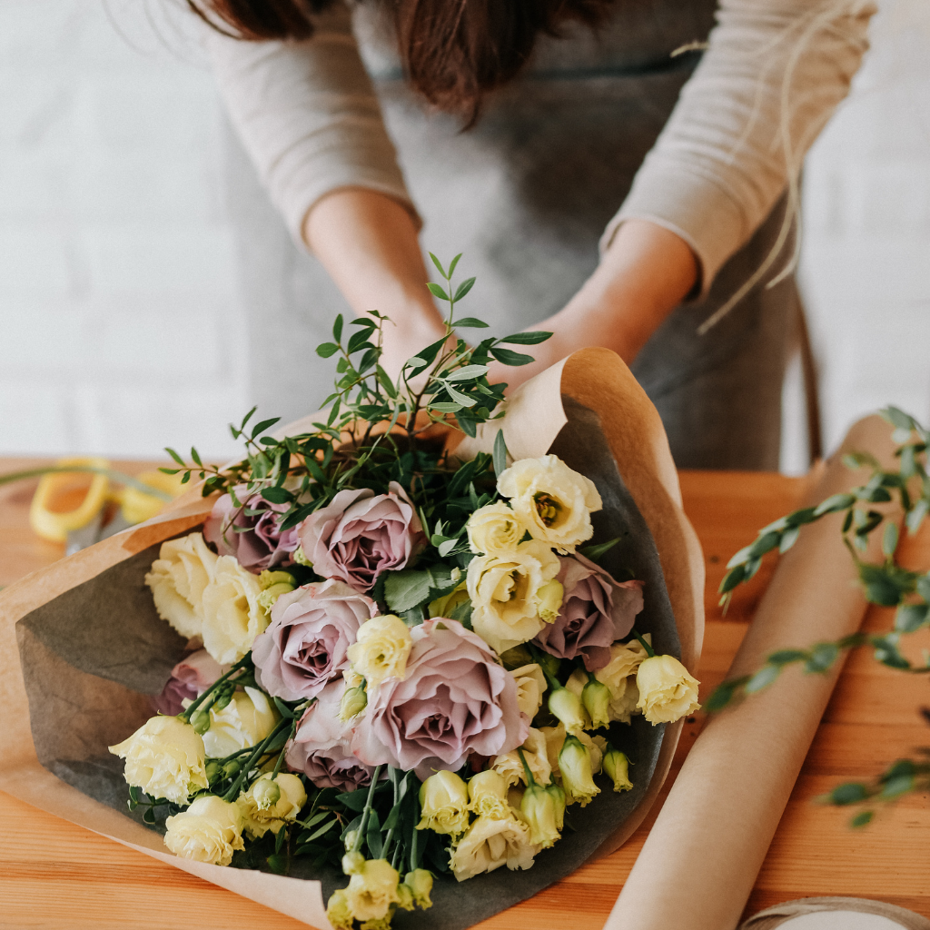 Flora-Bouquets-florist-preparing-bouquet