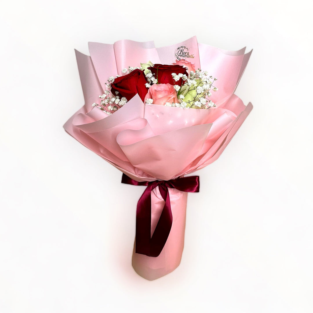bouquet-of-6-stalks-red-pink-white-roses-with-babys-breath-wrapped-in-pink-front