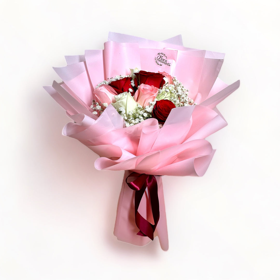 bouquet-of-9-stalks-red-pink-white-roses-with-babys-breath-wrapped-in-pink-front