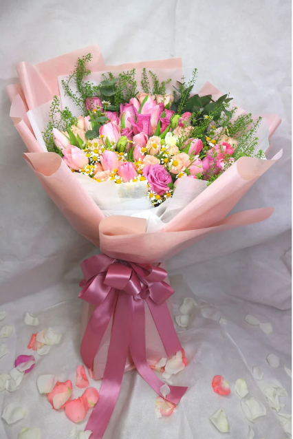 flowerbouquet-pink-tulips-lavender-roses-pink-roses-spray-pink-wrapper-against-a-white-background-with-scattered-petals-adding-a-touch-of-elegance