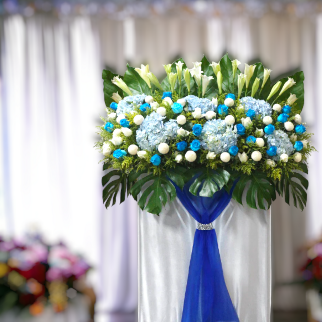 Funeral flower stand in Singapore adorned with a grand assortment of flowers and greenery, expressing heartfelt condolences