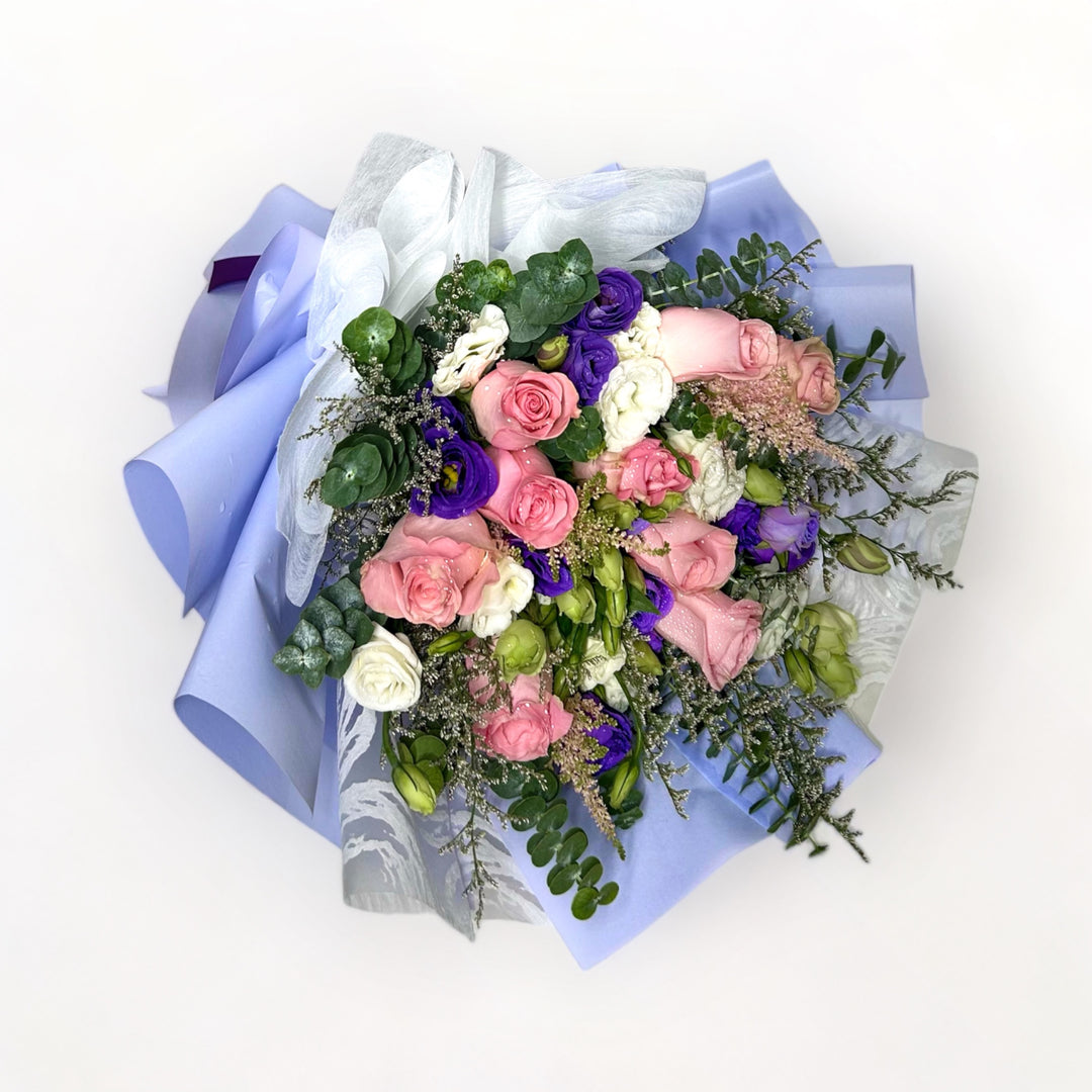 flowerbouquet-roses-eustoma-misty-blue-caspia-eucalyptus-purple-wrapper-with-white-background-side