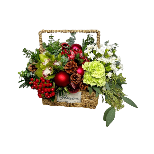floral arrangement in a basket filled with christmas arrangement of green and white flowers, red berries, pine cones, and christmas baubles, complet with decorative greenery