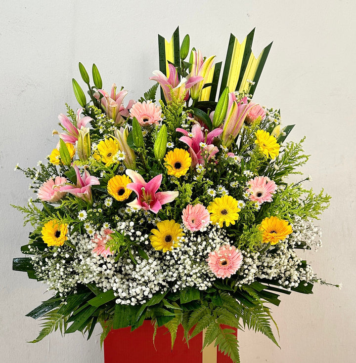 flowerstand-lily-gerbera-pheonix-babys-breath-pandanus-leaf-with-white-background-zoomed