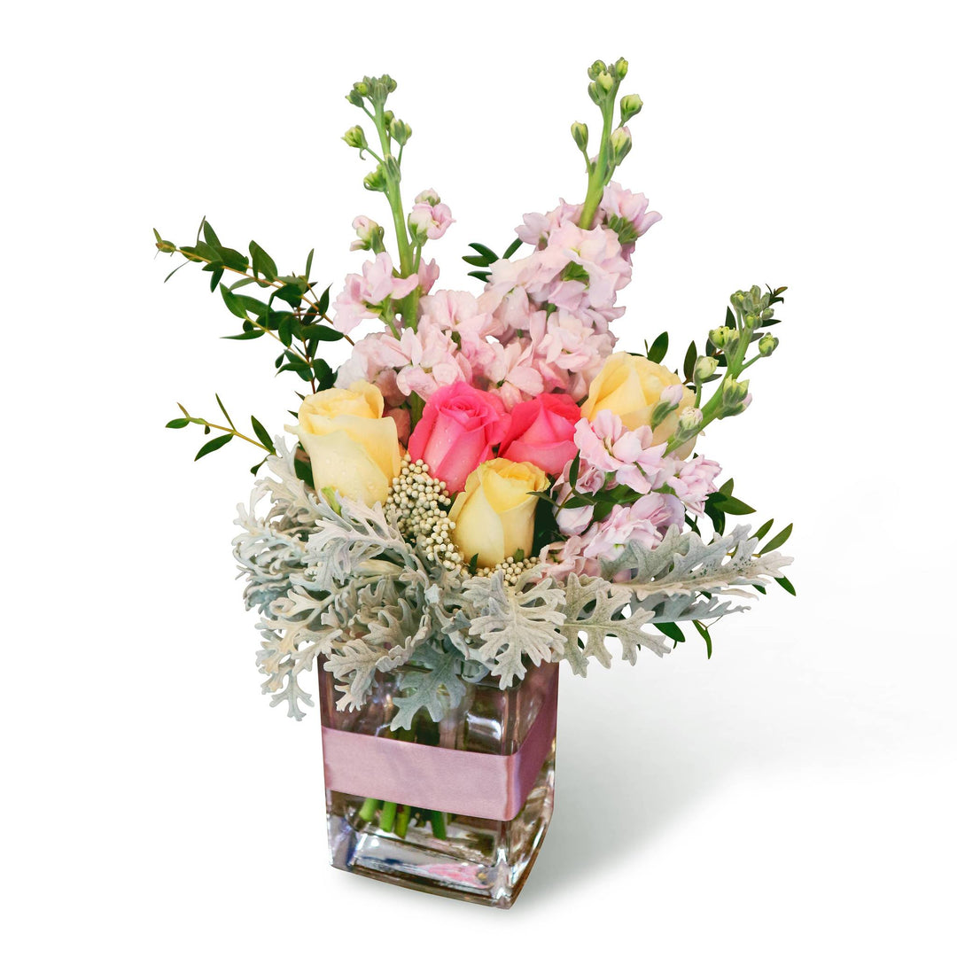 flora-in-vase-with-pink-ribbon-champagne-rose-pink-rose-pink-matthiola-with-white-background