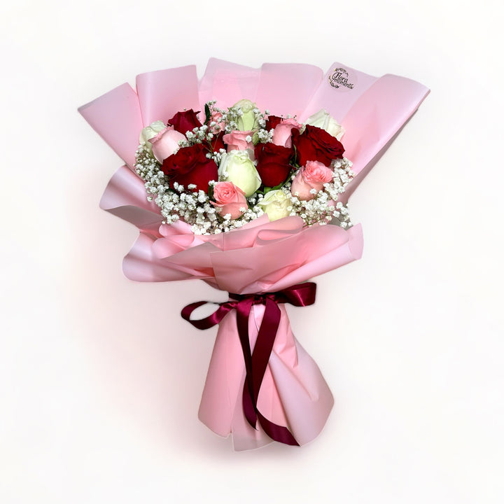 bouquet-of-18-stalks-red-pink-white-roses-with-babys-breath-wrapped-in-pink-front