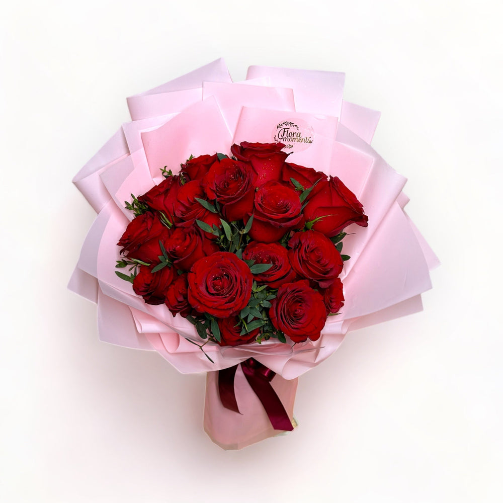 bouquet-of-18-stalks-red-roses-wrapped-in-pink-top