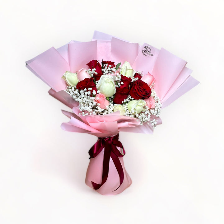 bouquet-of-24-stalks-red-pink-white-roses-with-babys-breath-wrapped-in-pink-front