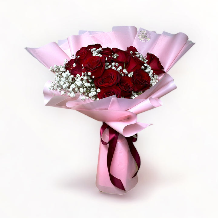 bouquet-of-24-stalks-red-roses-with-babys-breath-wrapped-in-pink-front