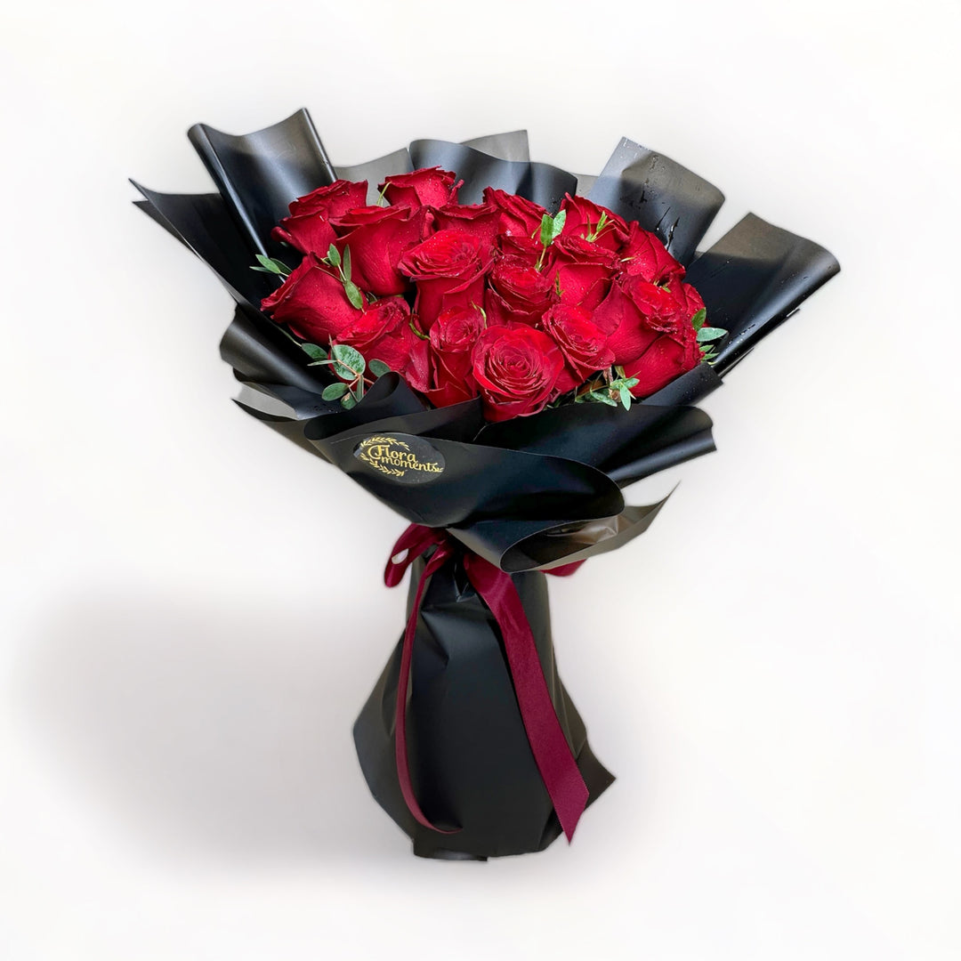 bouquet-of-24-stalks-red-roses-wrapped-in-black-front