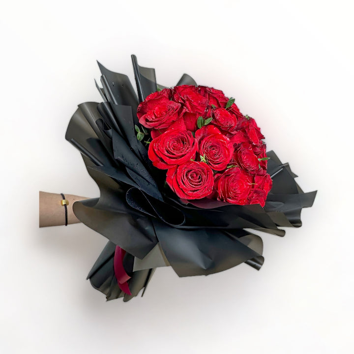 bouquet-of-34-stalks-red-roses-wrapped-in-black-hand