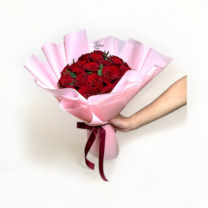 bouquet-of-34-stalks-red-roses-wrapped-in-pink-hand