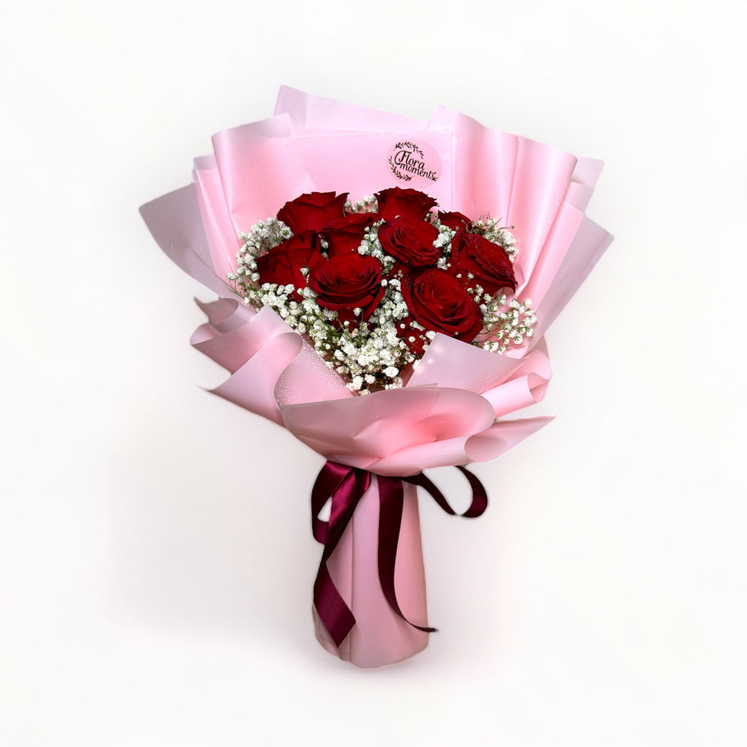 bouquet-of-9-stalks-red-roses-with-babys-breath-wrapped-in-pink-front