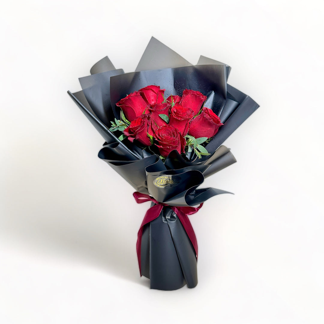 bouquet-of-9-stalks-red-roses-wrapped-in-black-front