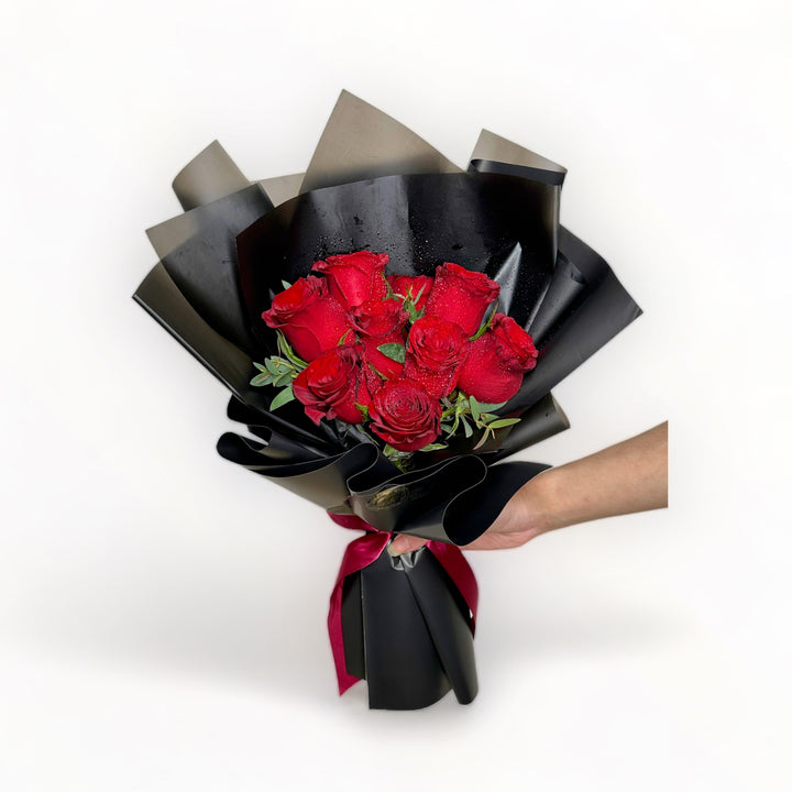 bouquet-of-9-stalks-red-roses-wrapped-in-black-hand