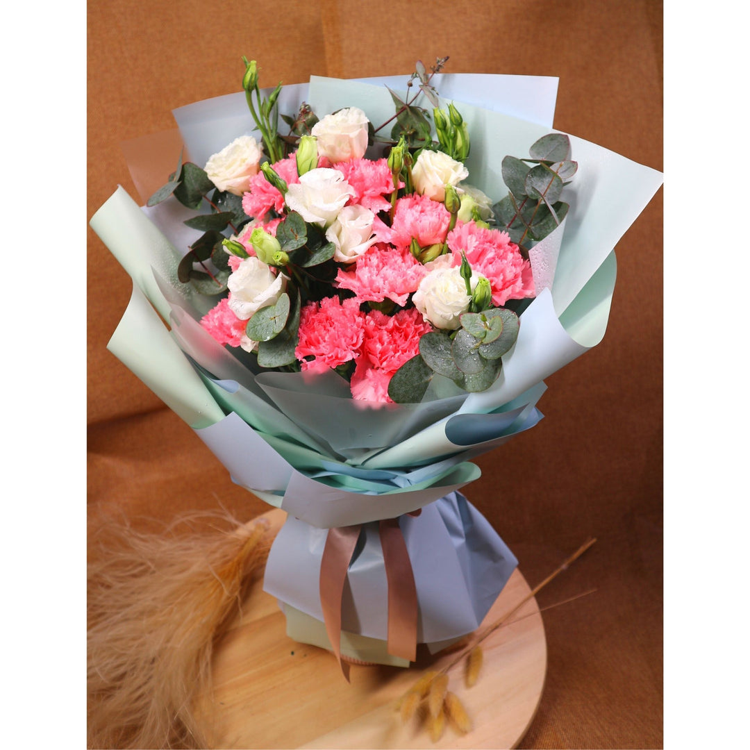 bouquet-pink-carnation-white-eustoma-eucalyptus-in-blue-wrapper-front