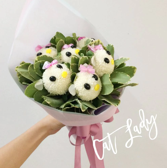 bouquet-white-marble-chrysanthemums-pittosporum-leaves-pink-wrapper