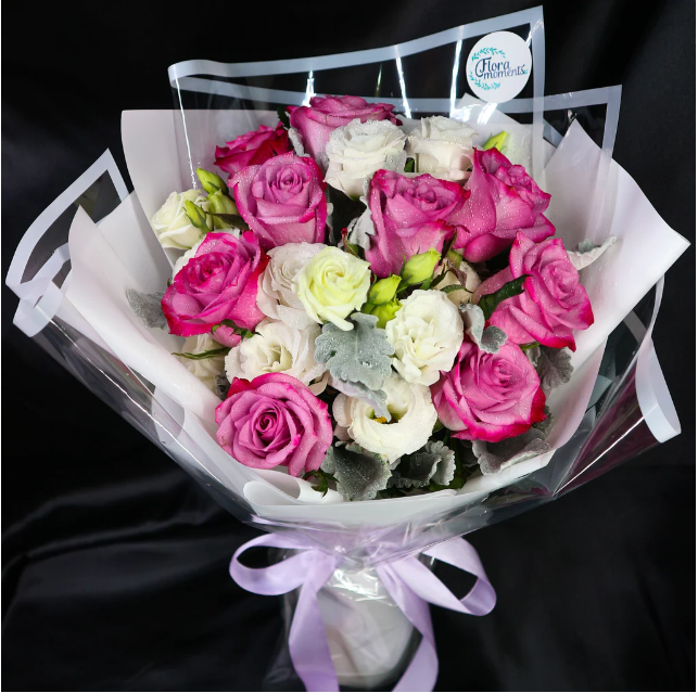 bouquet-yam-roses-eustomas-dusty-millers-silver-leaf-purple-ribbon-with-black-background