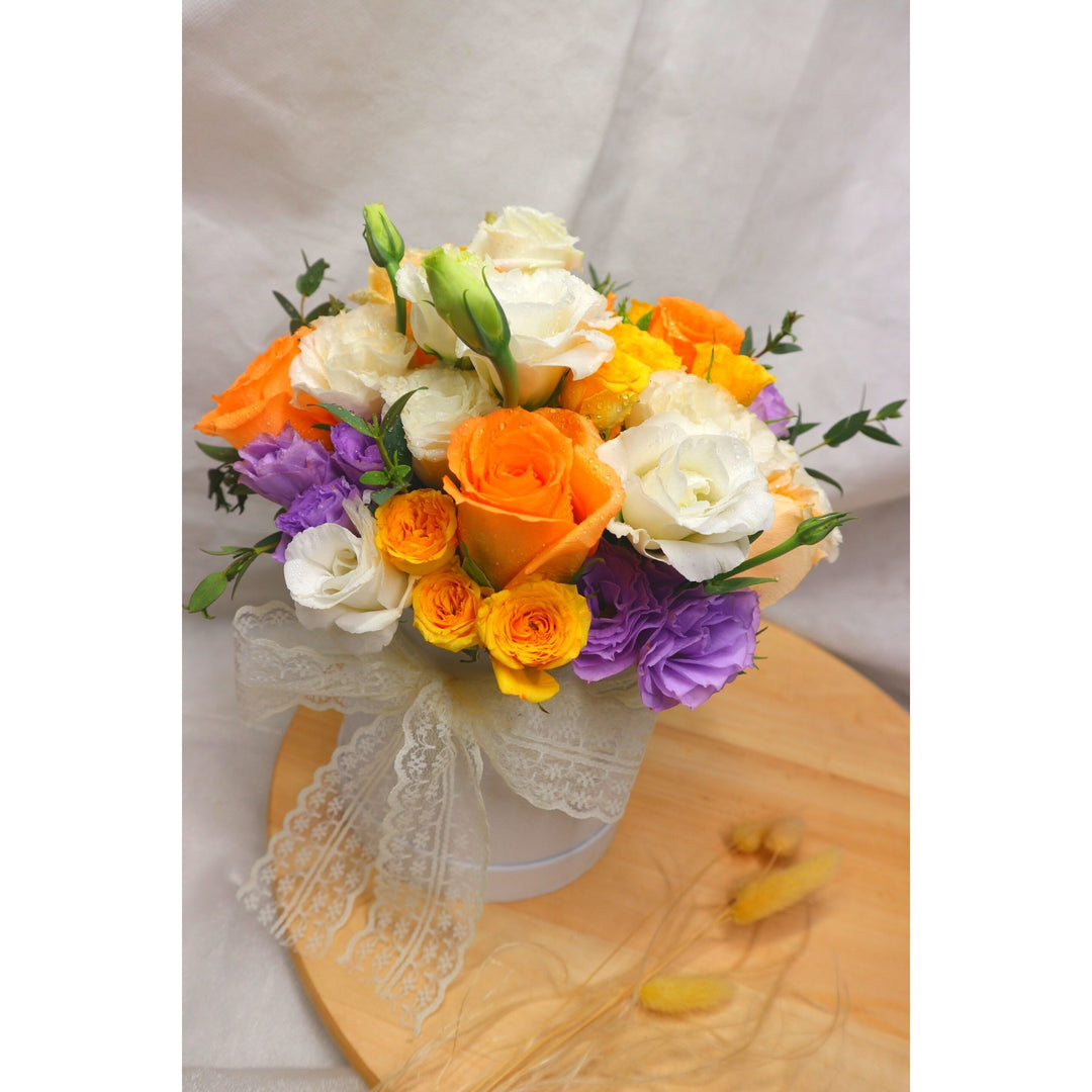 florabox-orange-champagne-roses-with-yellow-roses-and-purple-eustomas-top