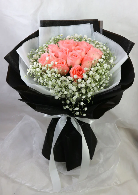 flowerbouquet-pink-roses-baby's-breath-in-black-wrapper-white-ribbon-with-white-background